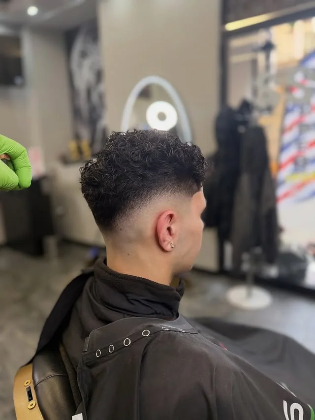 Curly top mid fade